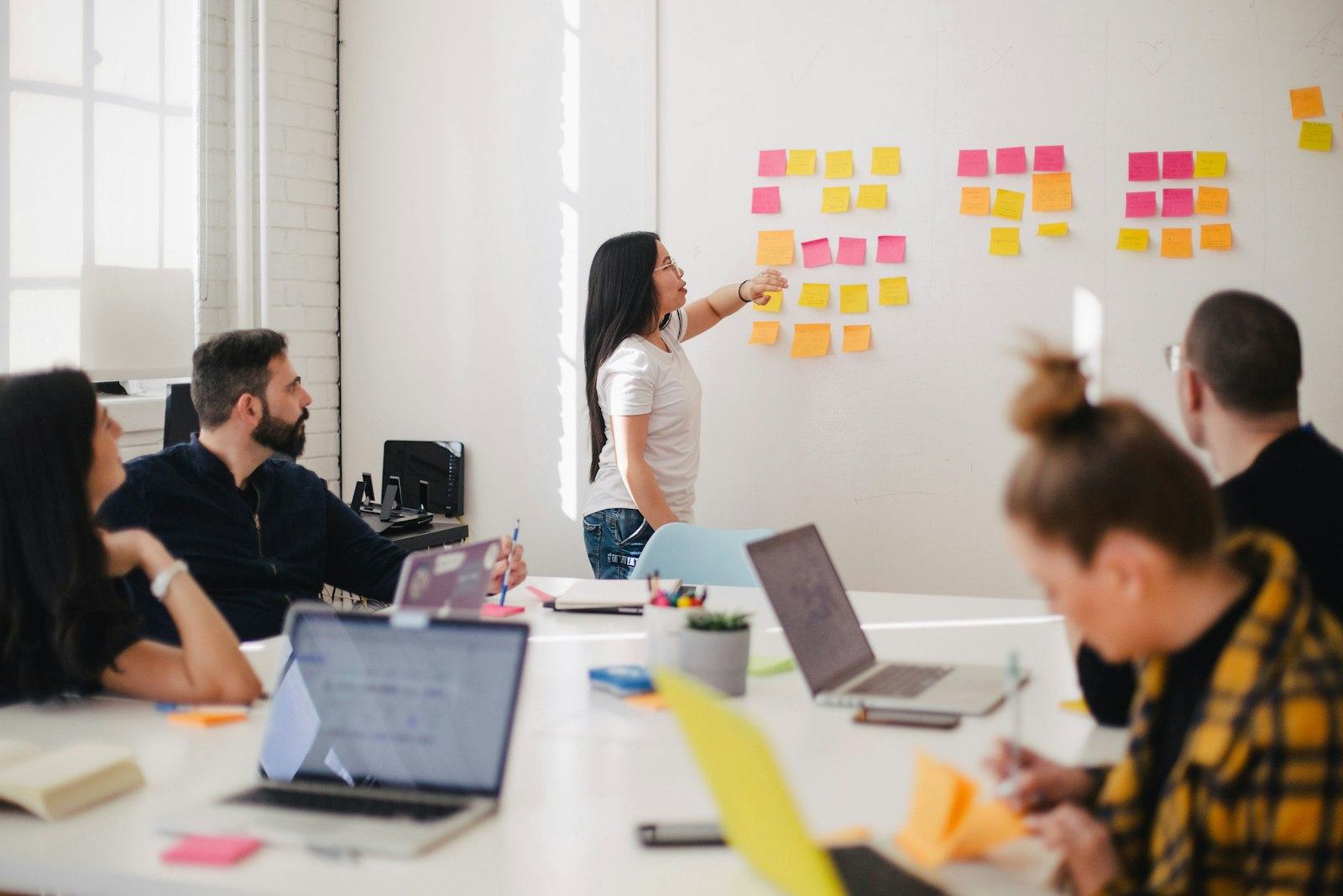 Team mapping a workflow on sticky notes during a discovery workshop